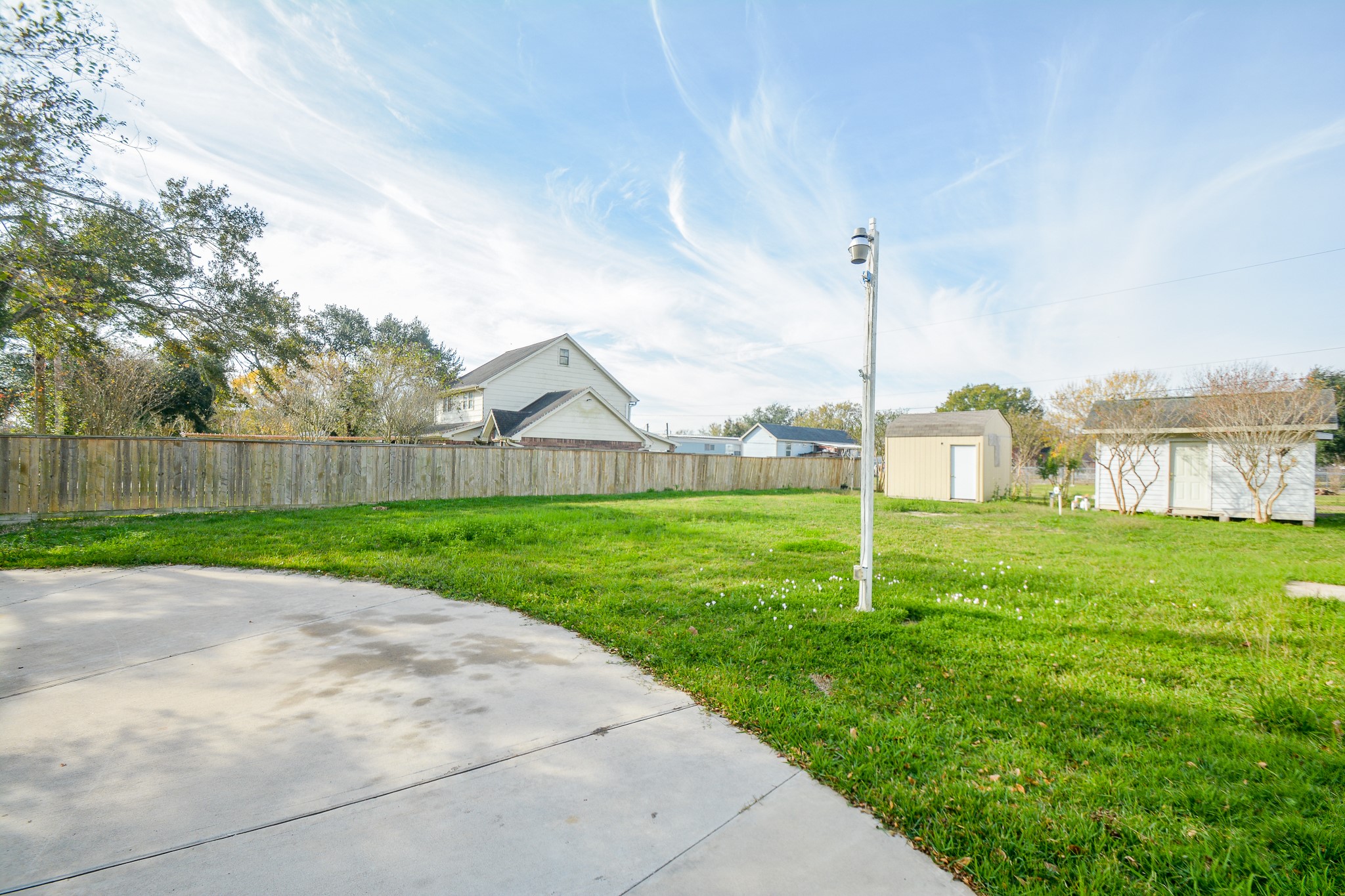 3610 Alice Street Fresno, TX 77545 - Photo 25 of 26 a view of a house with a big yard and a large tree