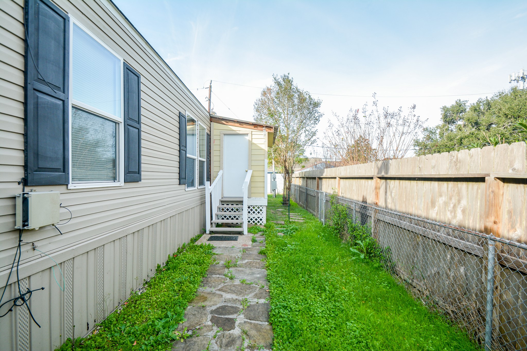 3610 Alice Street Fresno, TX 77545 - Photo 26 of 26 a view of a garden with wooden fence