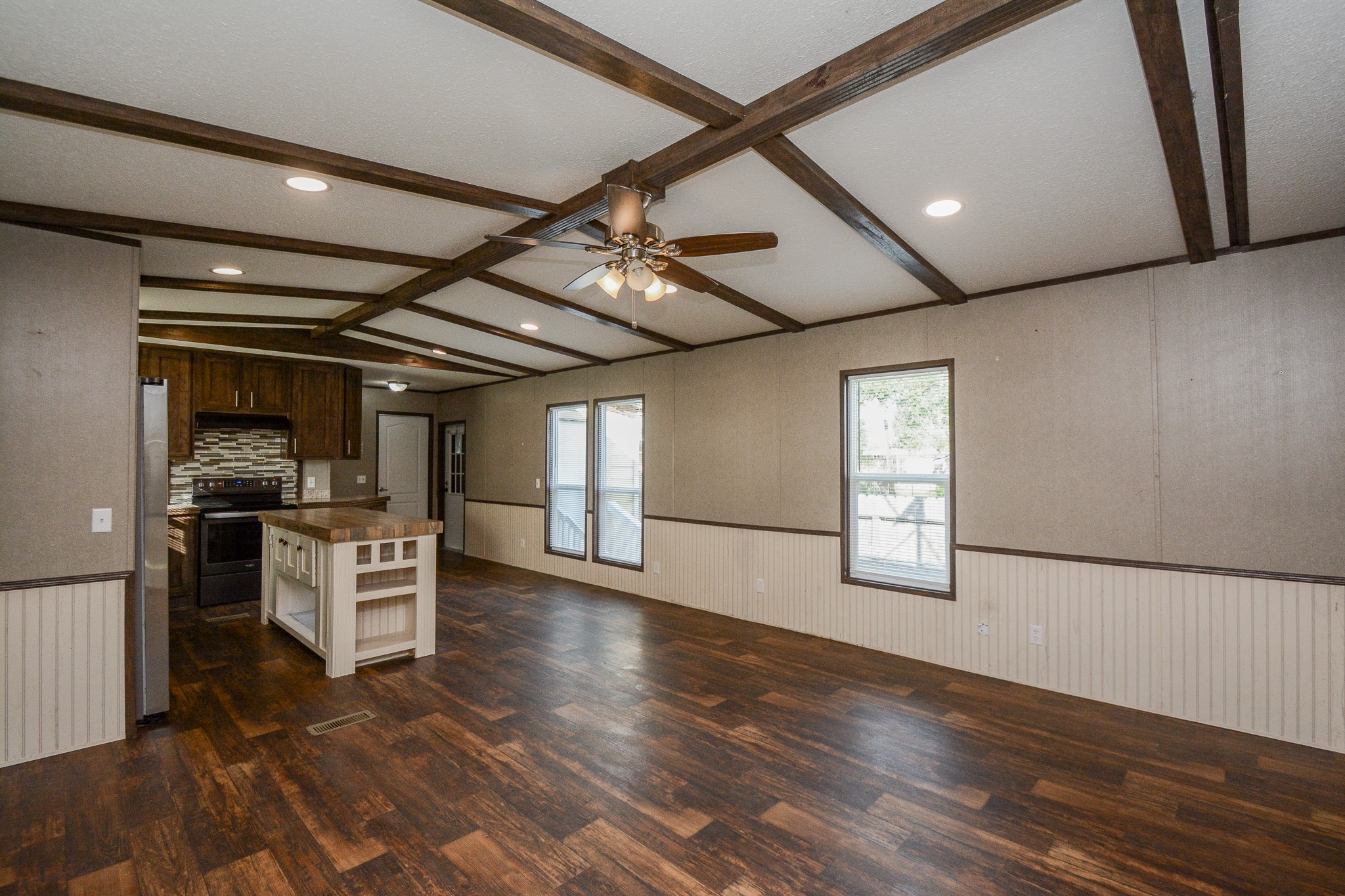 3610 Alice Street Fresno, TX 77545 - Photo 5 of 26 a view of a electric appliances in kitchen and empty room with wooden floor