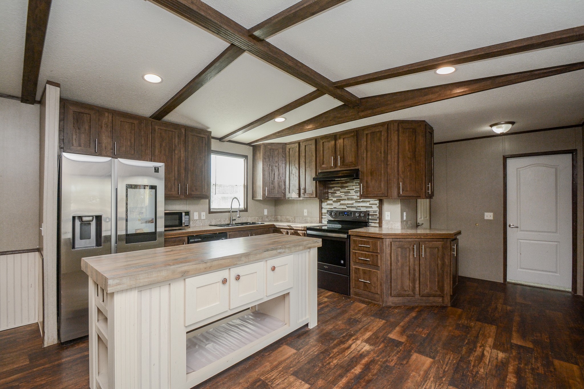 3610 Alice Street Fresno, TX 77545 - Photo 7 of 26 a kitchen with stainless steel appliances granite countertop a stove a sink and a refrigerator