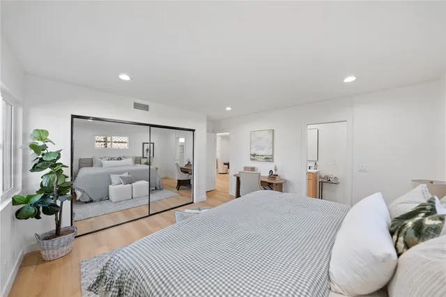 a bedroom with bed and a couch