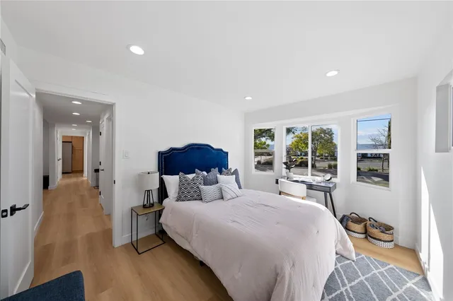 a bed room with a bed and a chair