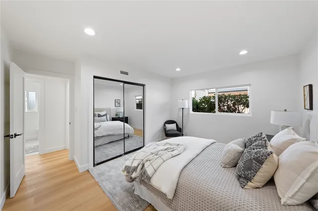 a bedroom with a large bed and a couch