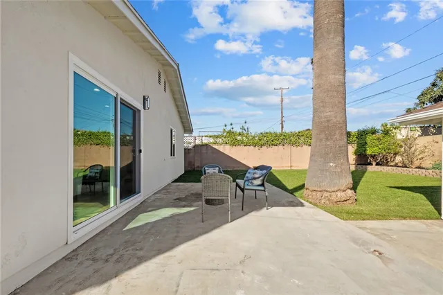 a house view with a sitting space and garden space