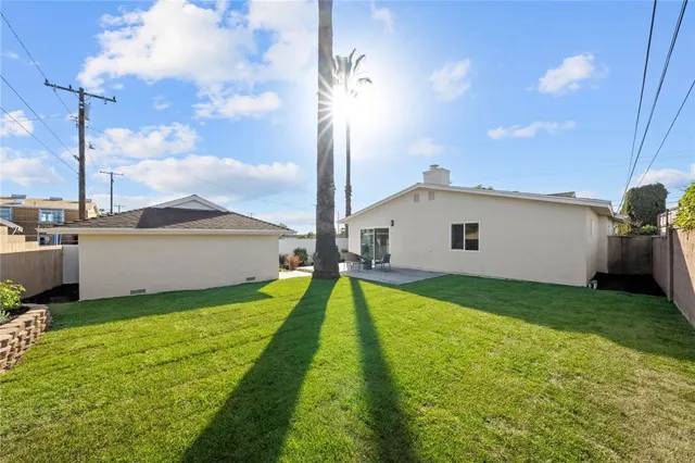 a view of backyard with a garden and deck