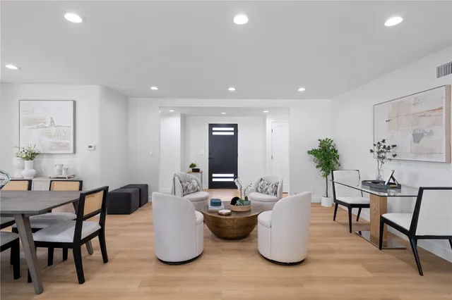 a living room with furniture and a table