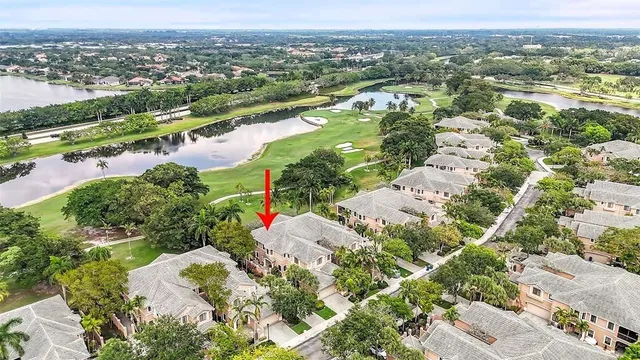 an aerial view of lake residential houses with outdoor space and trees