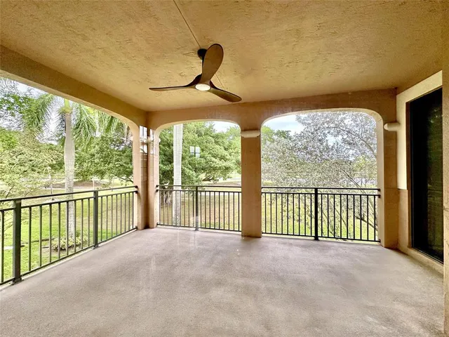 a view of a porch with a floor to ceiling window