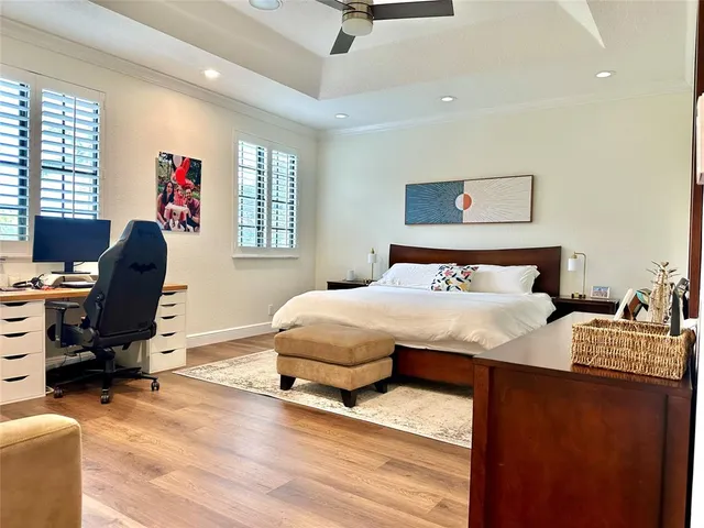 a bedroom with a bed and a chair