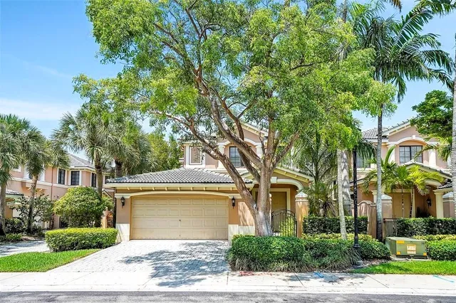 front view of a house with a garden