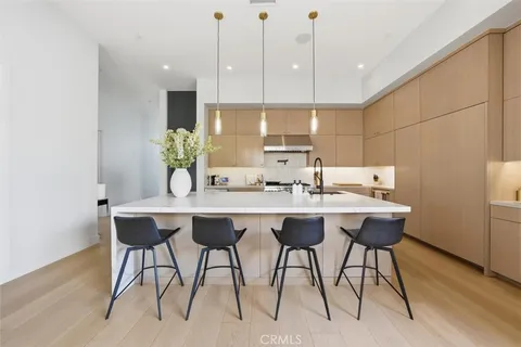 a kitchen with a table and chairs in it