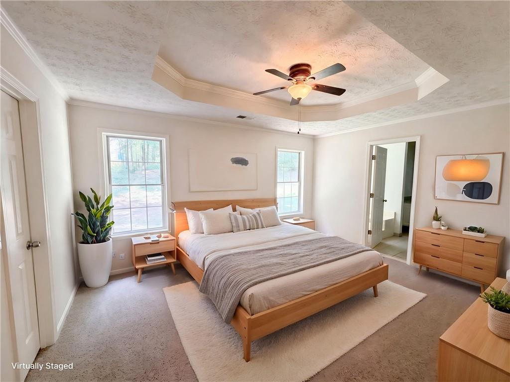 722 Ridgetop Road Bethlehem, GA 30620 - Photo 11 of 23 a spacious bedroom with a large bed and a chandelier