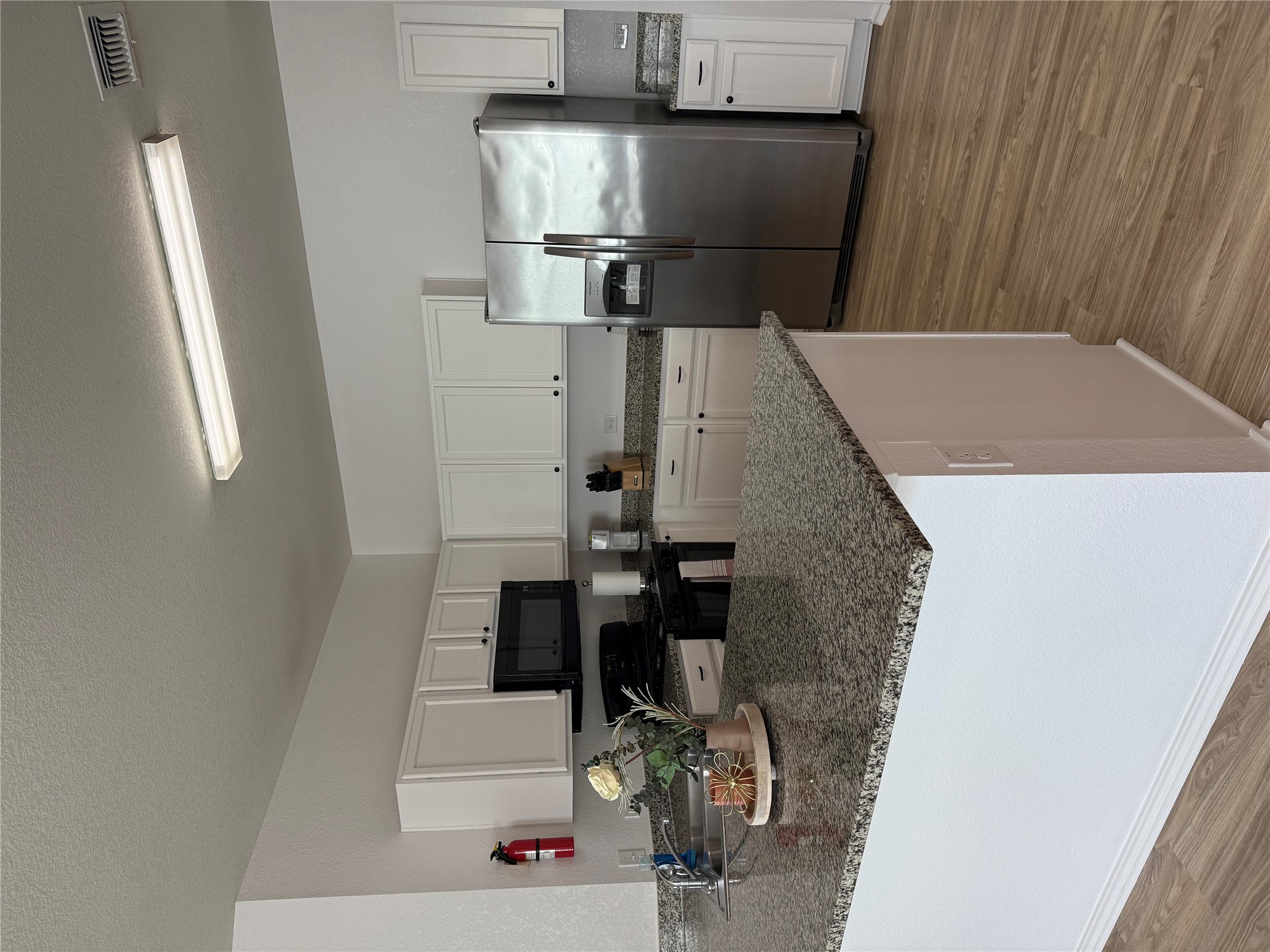 14907 Retha Pass Austin, TX 78725 - Photo 11 of 12 A well-appointed culinary space featuring sleek granite countertops and modern appliances.