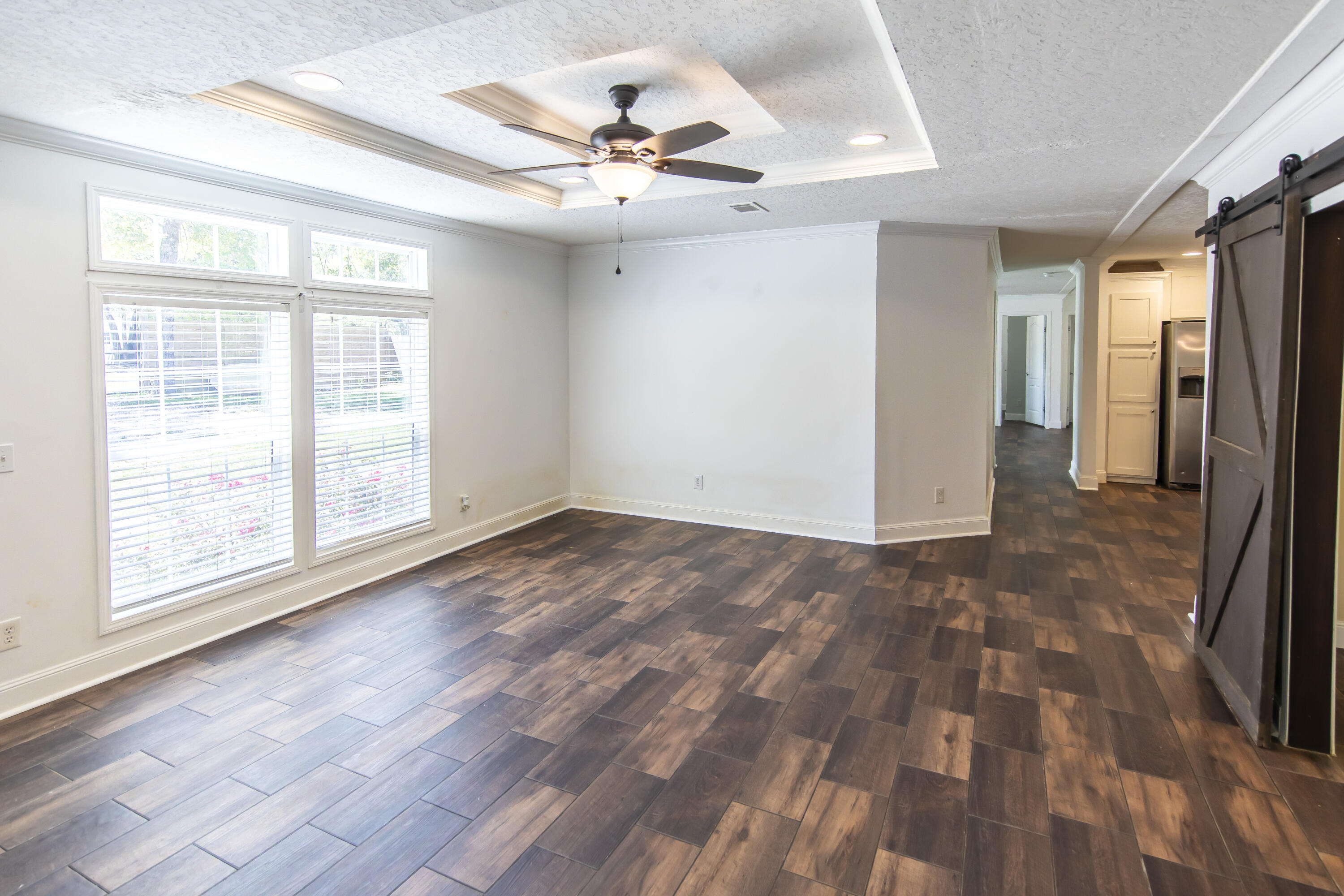748 Phillips Drive Freeport, FL 32439 - Photo 11 of 50 wooden floor in an empty room with a window