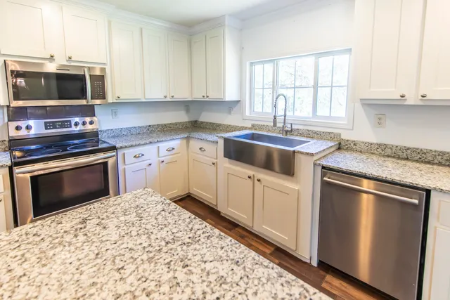 a kitchen with a stove and a microwave