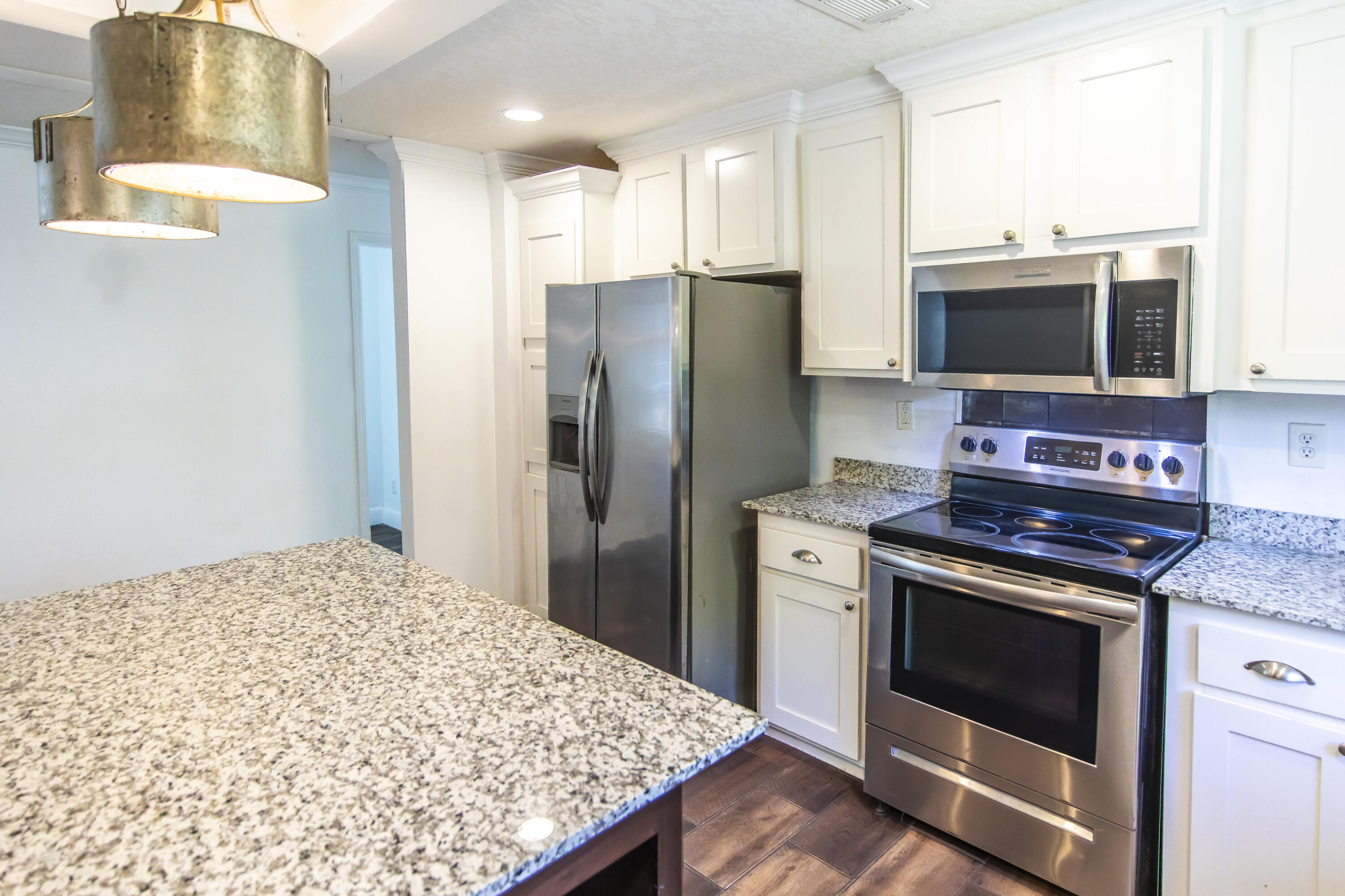 748 Phillips Drive Freeport, FL 32439 - Photo 17 of 50 a kitchen with a stove and a refrigerator