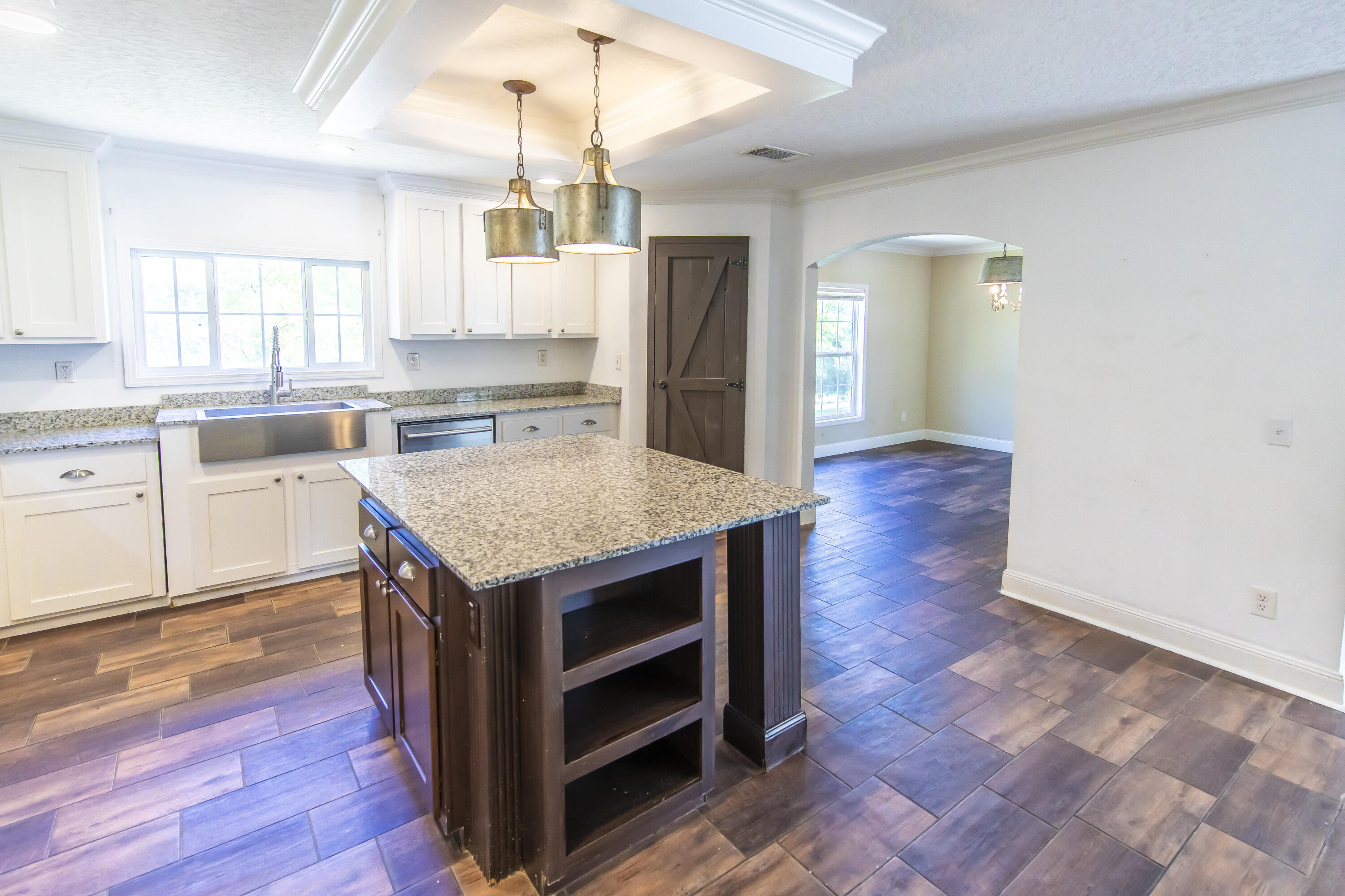 748 Phillips Drive Freeport, FL 32439 - Photo 18 of 50 a kitchen with a stove and a wooden floors