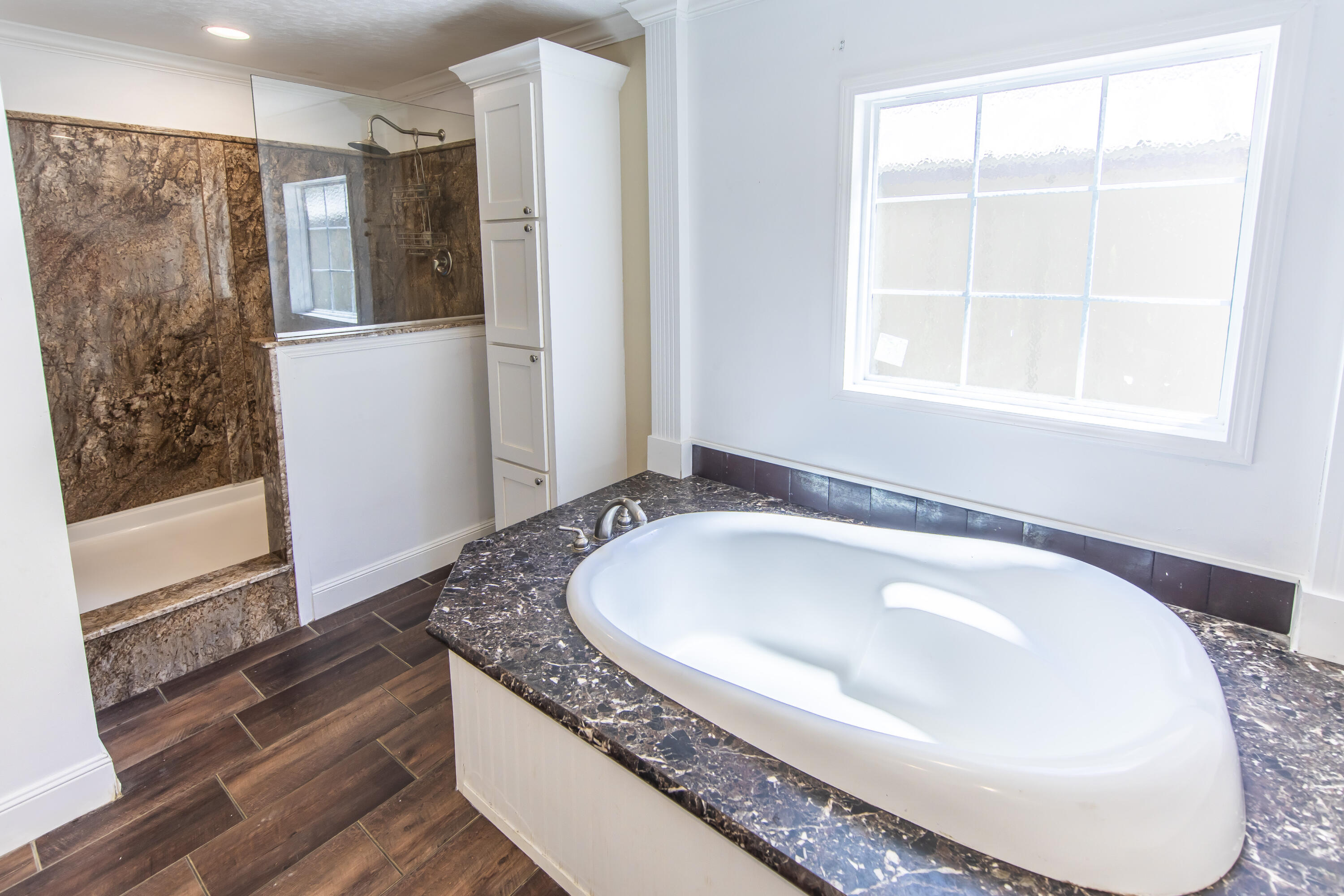 748 Phillips Drive Freeport, FL 32439 - Photo 25 of 50 a bathroom with a tub sink and mirror