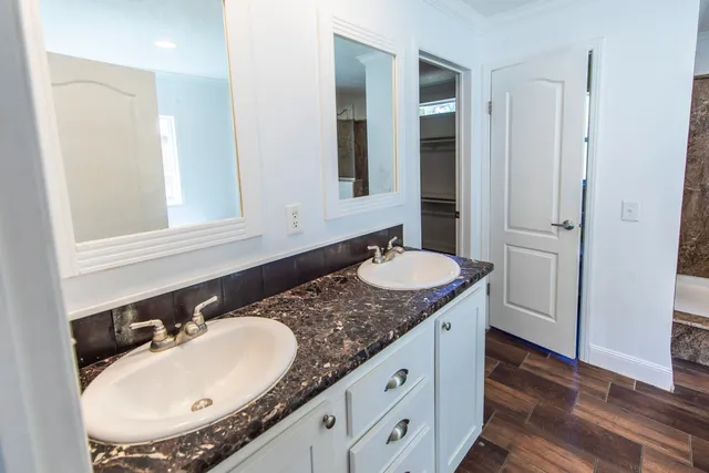 a bath tub sitting in a bathroom next to a window