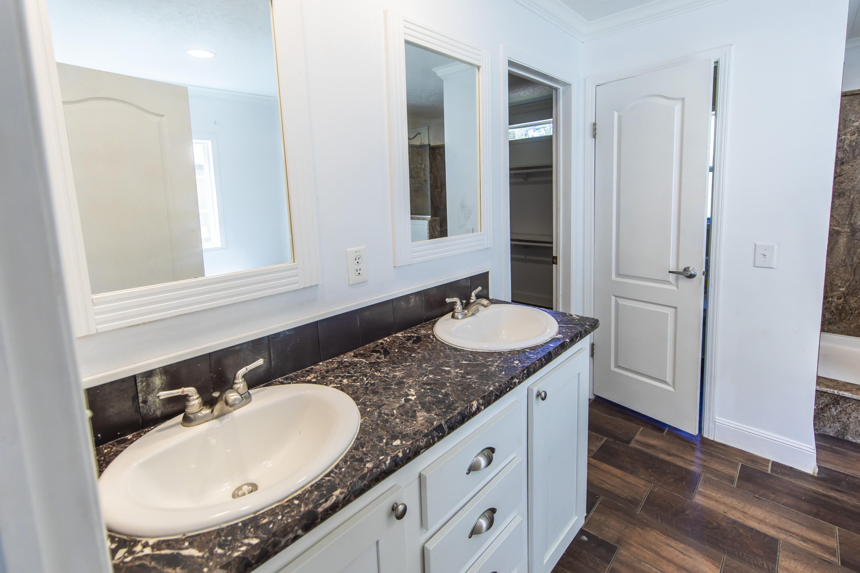 748 Phillips Drive Freeport, FL 32439 - Photo 26 of 50 a bathroom with a sink and a mirror