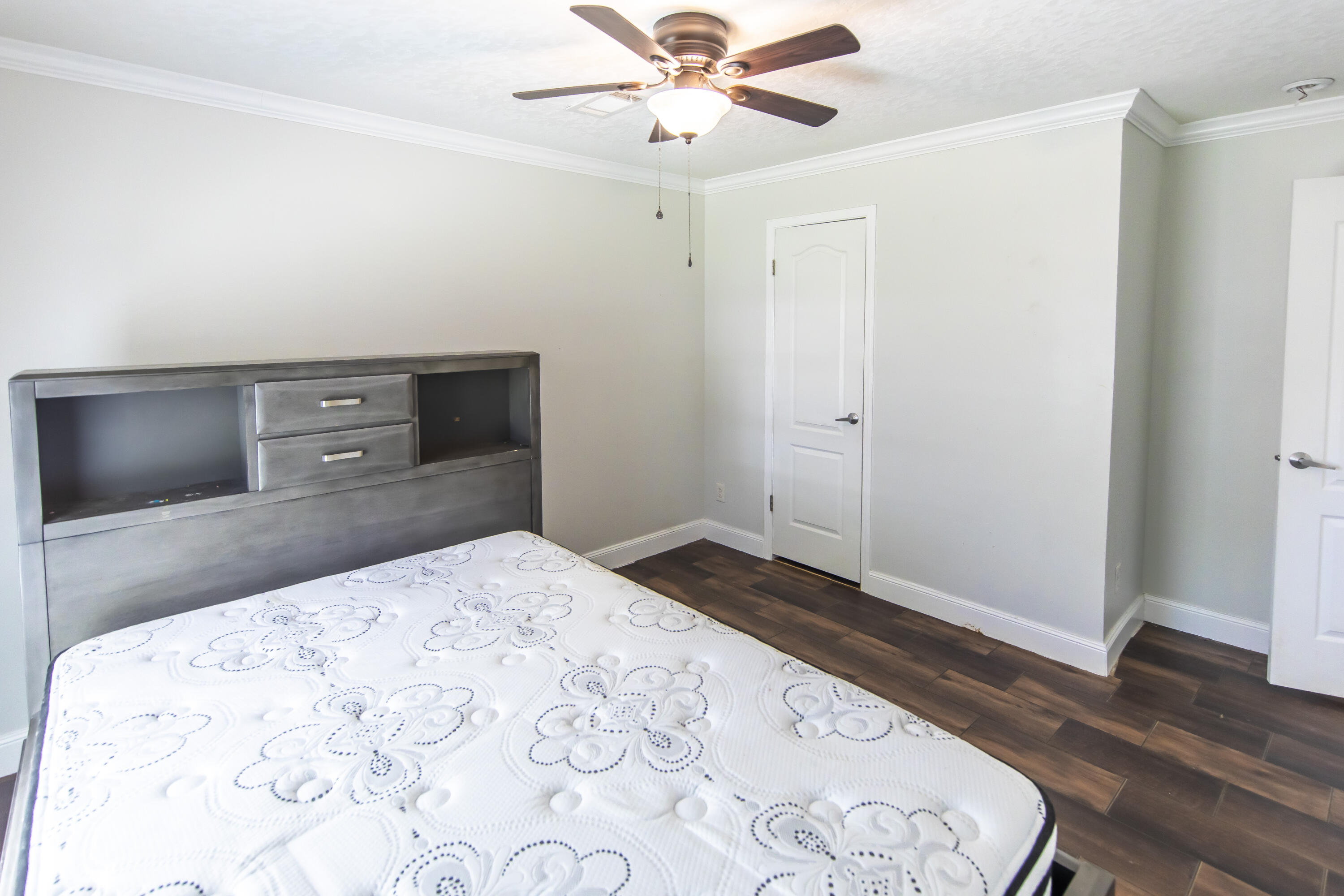 748 Phillips Drive Freeport, FL 32439 - Photo 34 of 50 a bedroom with a bed and a flat screen tv