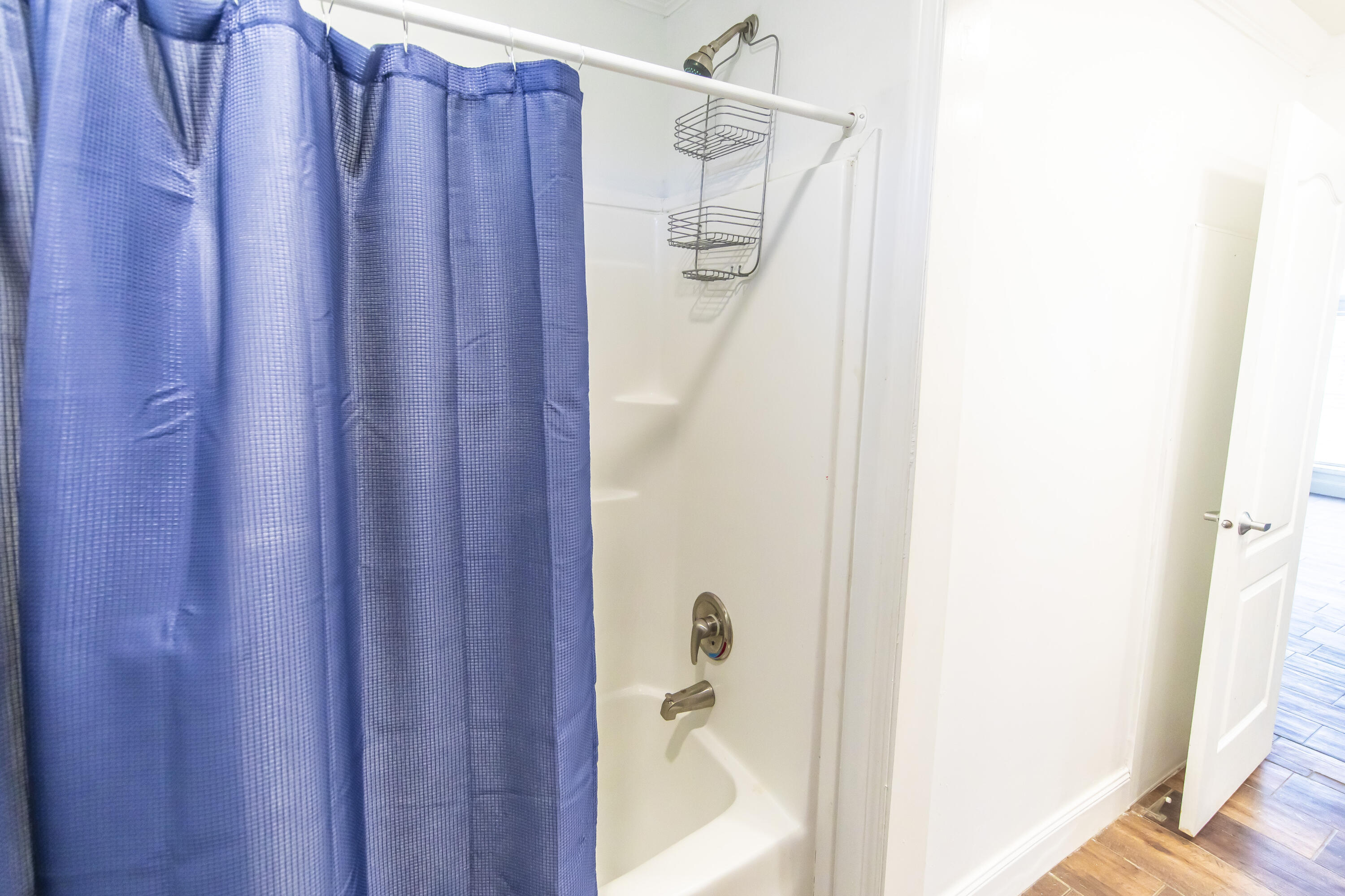 748 Phillips Drive Freeport, FL 32439 - Photo 35 of 50 a bathroom with a shower and a tub