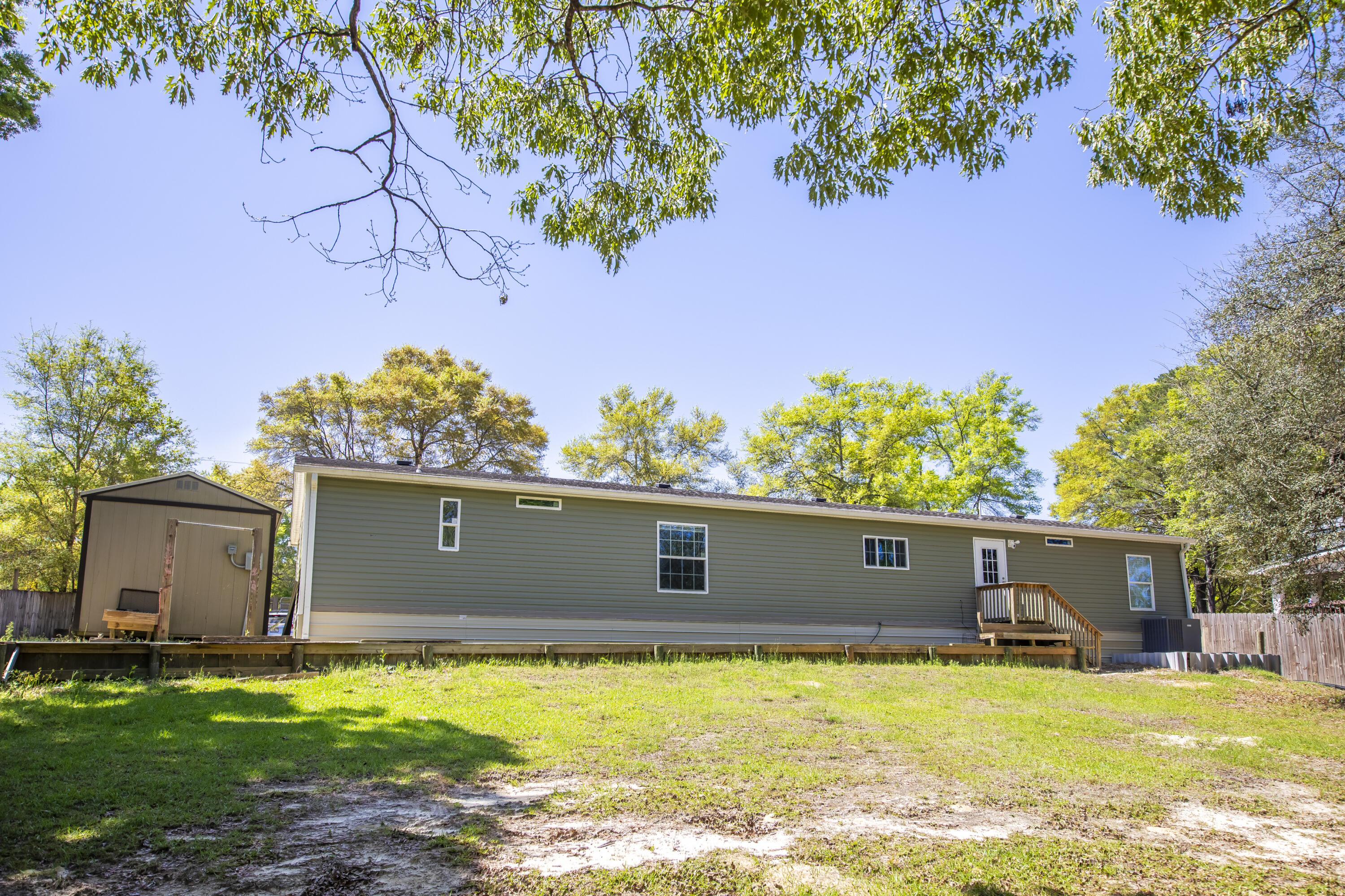 748 Phillips Drive Freeport, FL 32439 - Photo 38 of 50 a view of a house with a yard