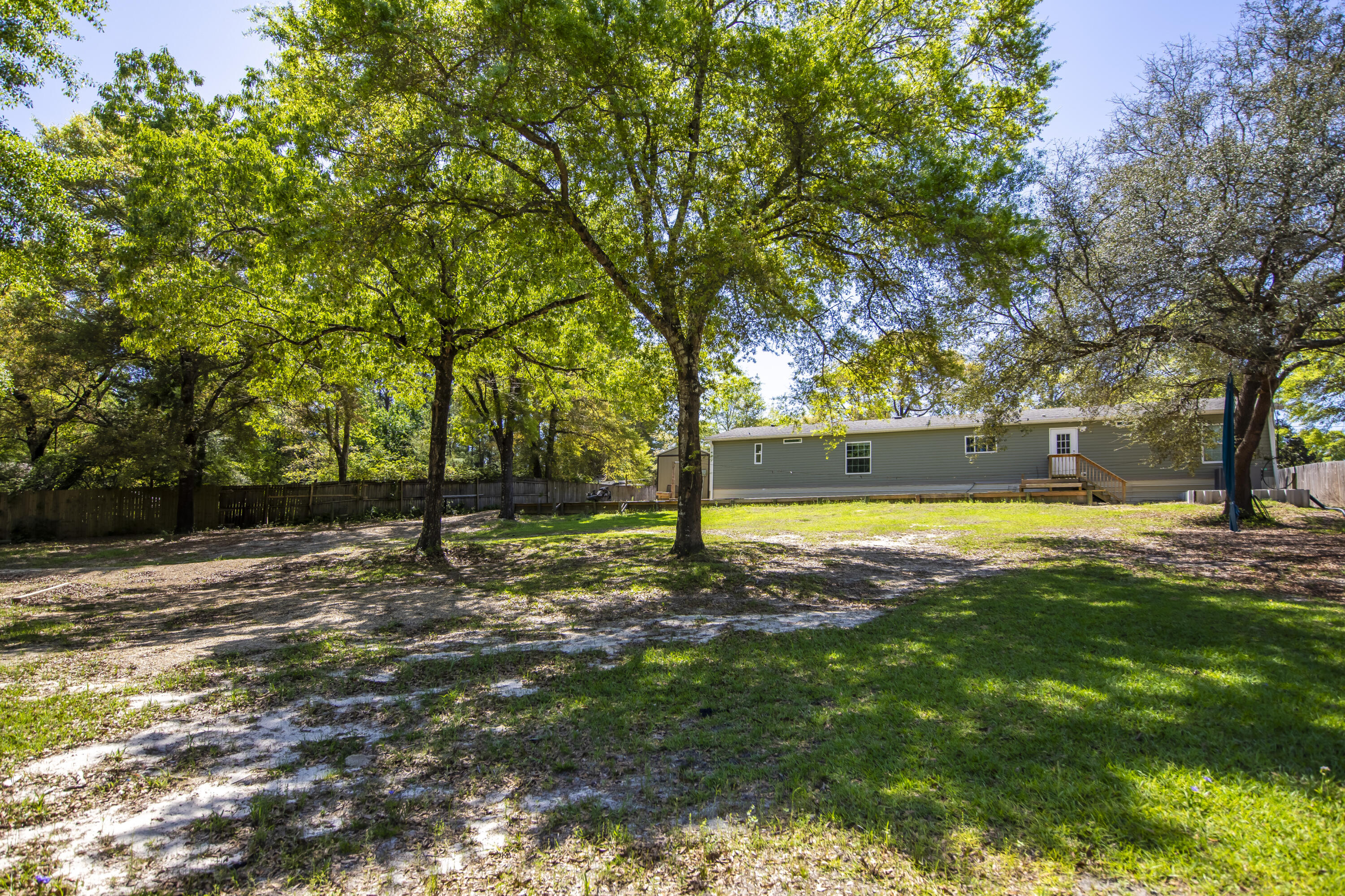 748 Phillips Drive Freeport, FL 32439 - Photo 42 of 50 a view of a yard with trees