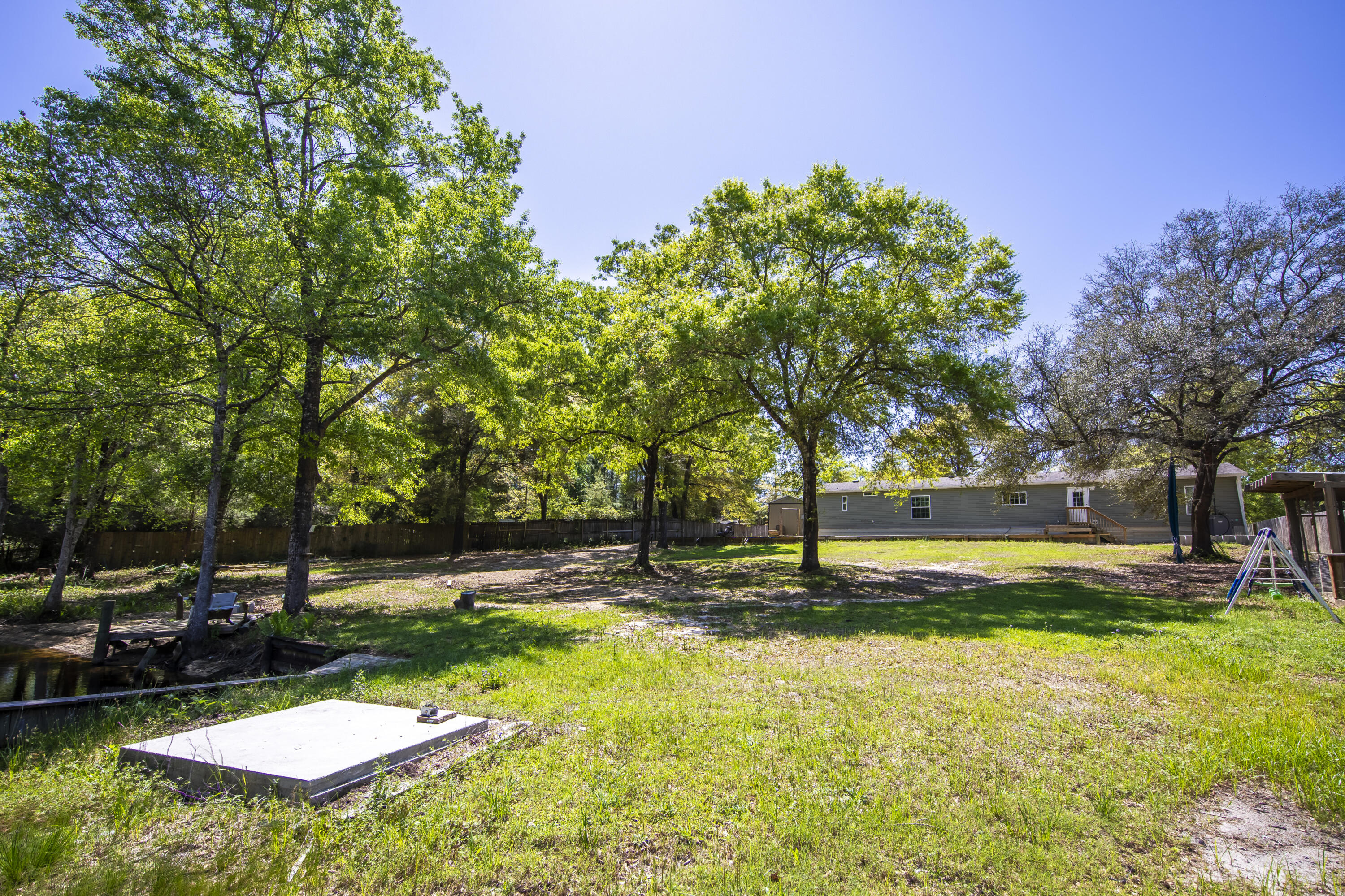 748 Phillips Drive Freeport, FL 32439 - Photo 43 of 50 a view of a swimming pool with a yard