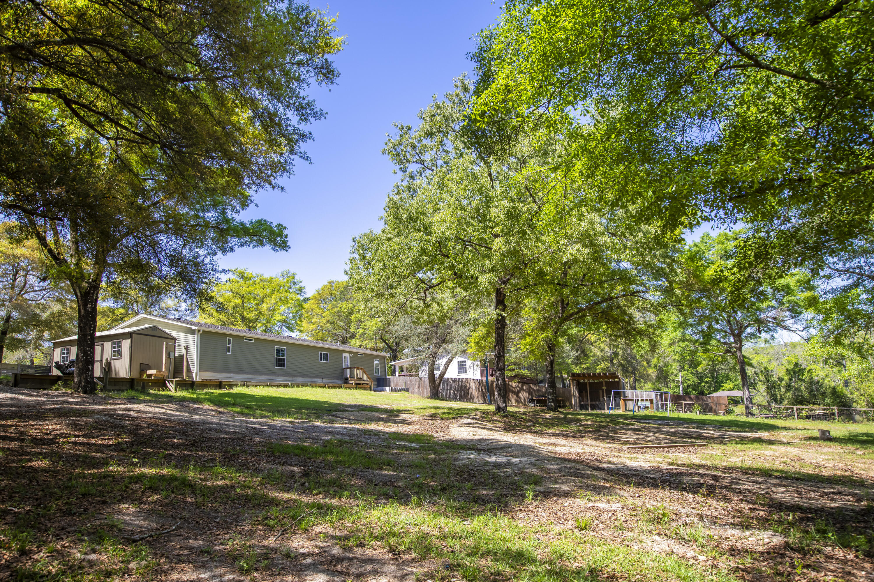 748 Phillips Drive Freeport, FL 32439 - Photo 45 of 50 a front view of a house with a yard
