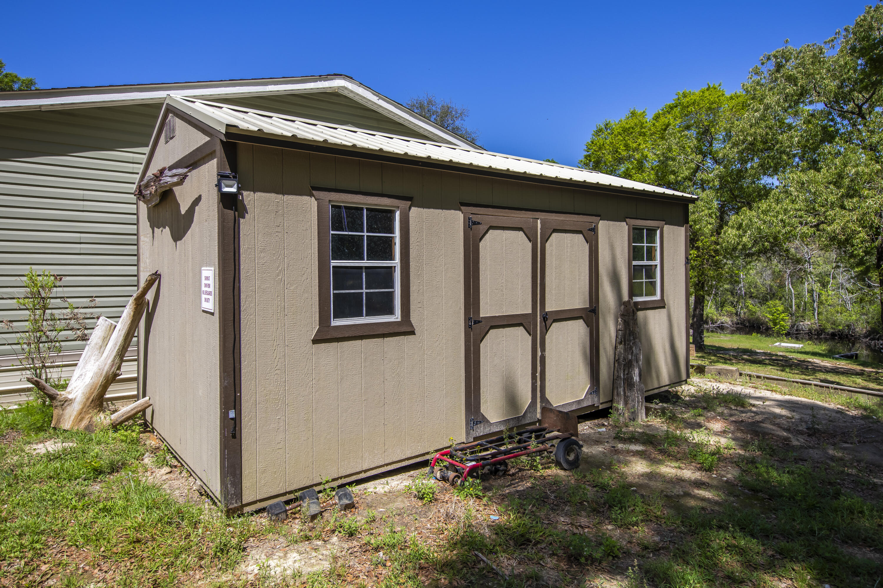 748 Phillips Drive Freeport, FL 32439 - Photo 50 of 50 a front view of a house with garden