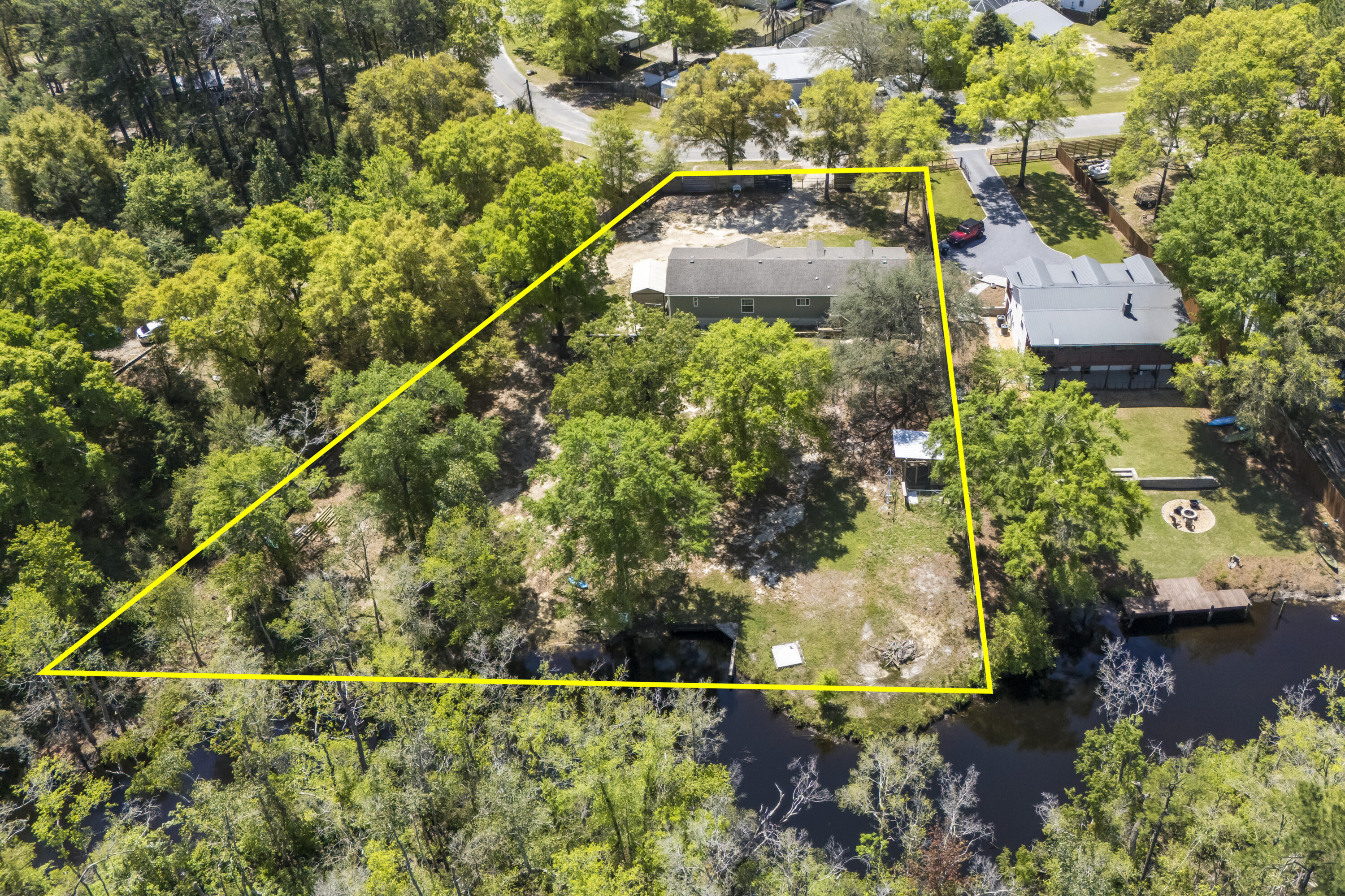 748 Phillips Drive Freeport, FL 32439 - Photo 6 of 50 an aerial view of a house with a yard and lake view