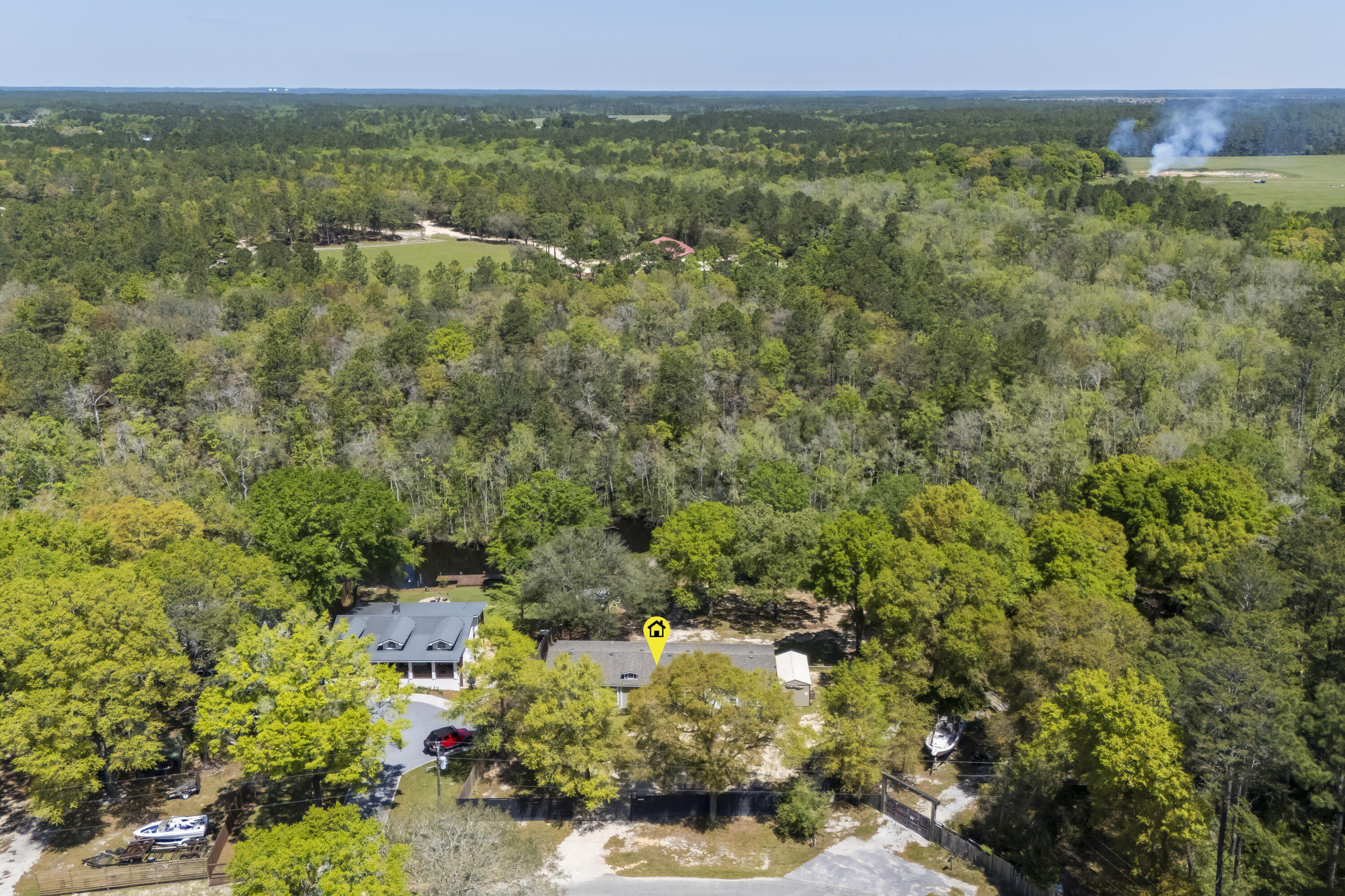 748 Phillips Drive Freeport, FL 32439 - Photo 8 of 50 a view of a bunch of trees and houses