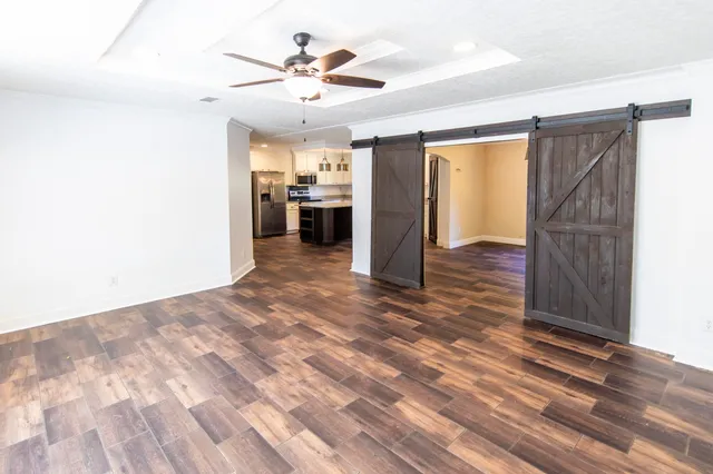 a view of a kitchen with a sink and a window