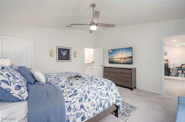 a bedroom with a large bed and a dresser