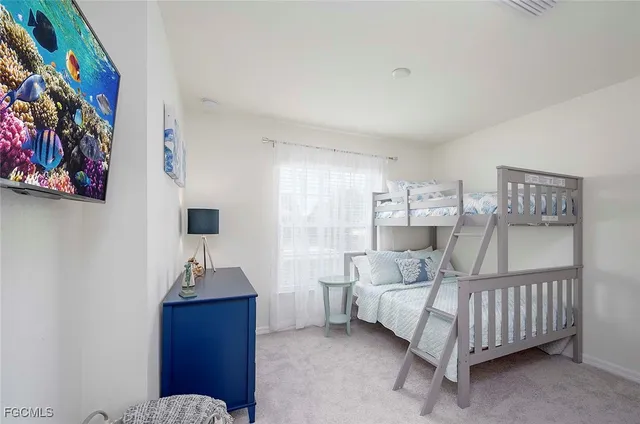 a bedroom with furniture and a chandelier