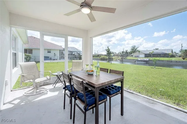 a view of a dining room with furniture and a yard
