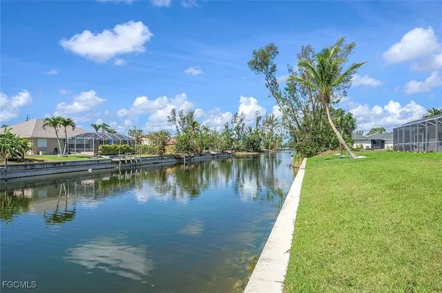 a view of a lake with a house in the background