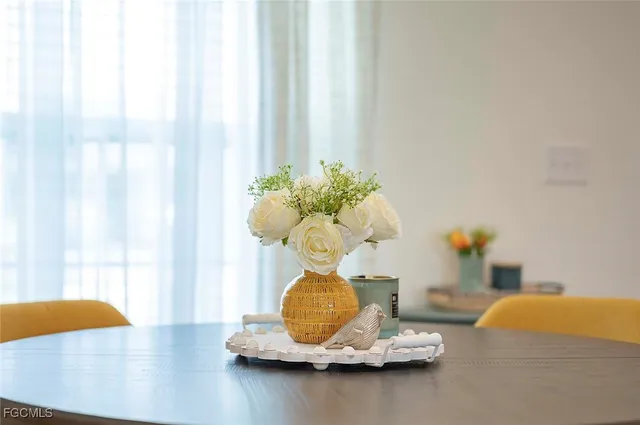 a vase of flowers sitting on a table