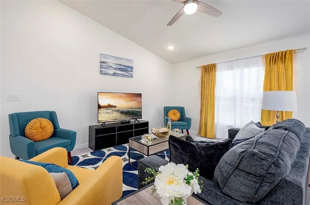 a living room with furniture and a flat screen tv