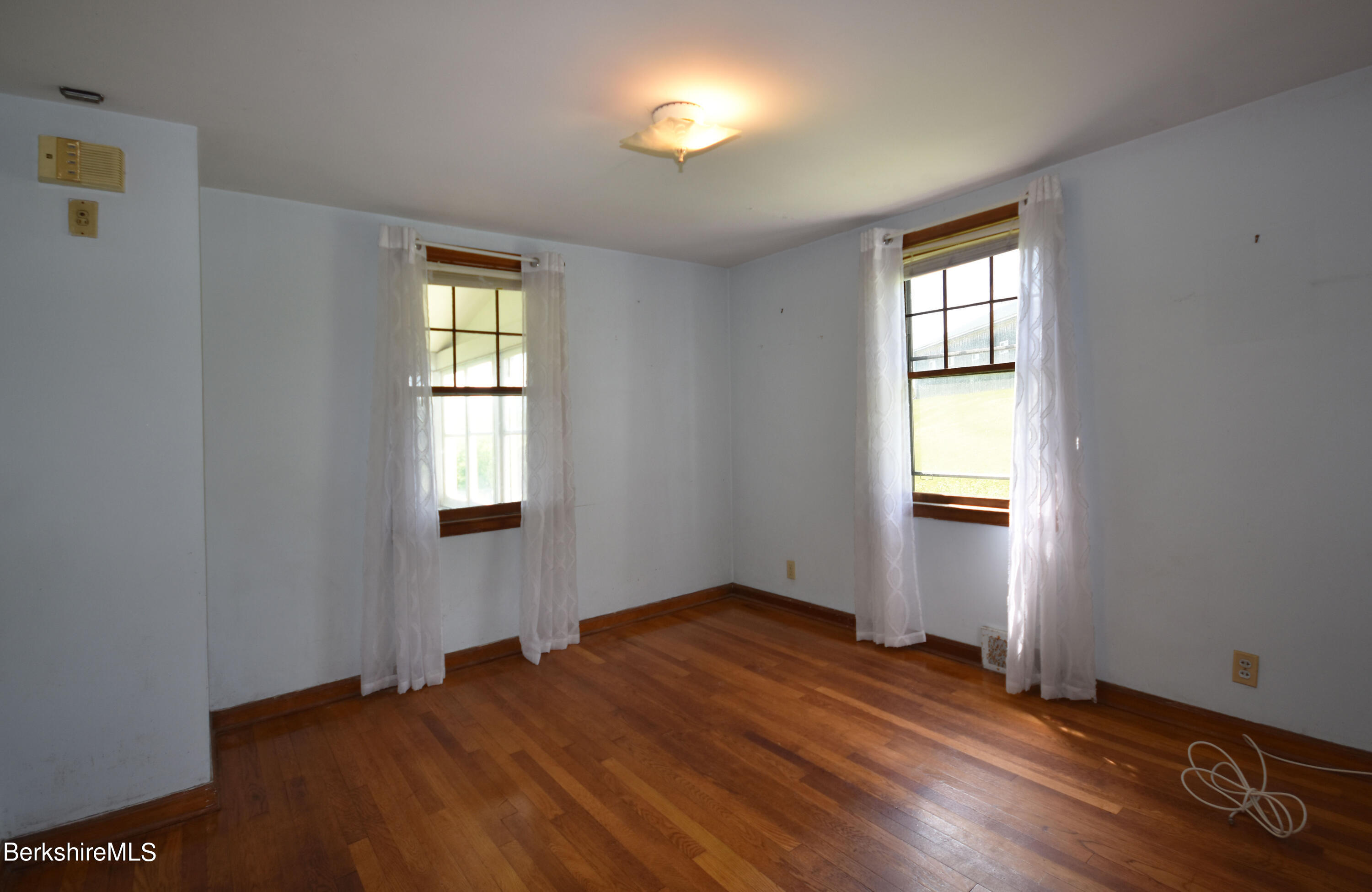 1649 State Road Richmond, MA 01254 - Photo 20 of 43 a view of empty room with wooden floor and fan