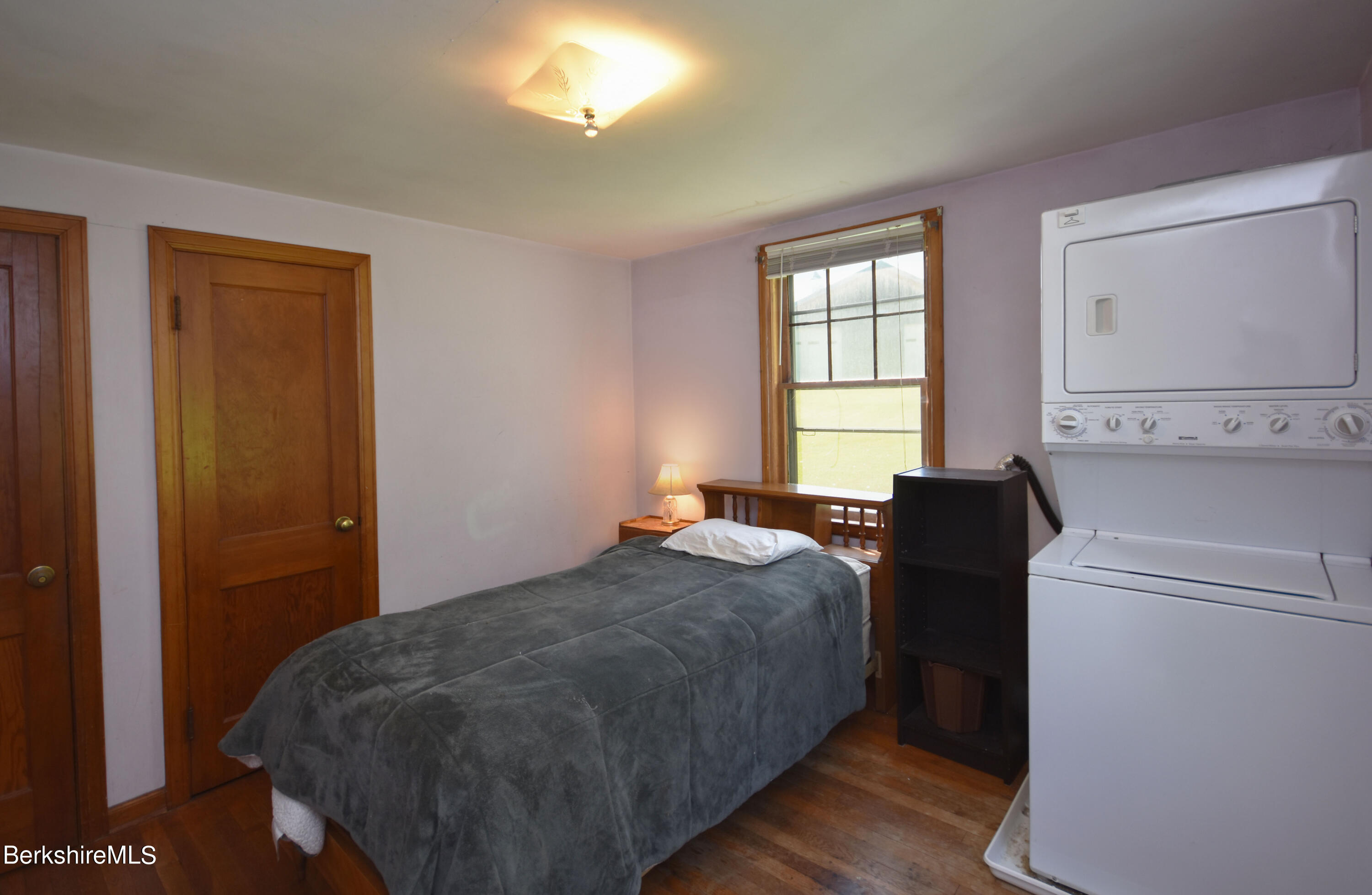 1649 State Road Richmond, MA 01254 - Photo 24 of 43 a bed sitting in a room next to a window