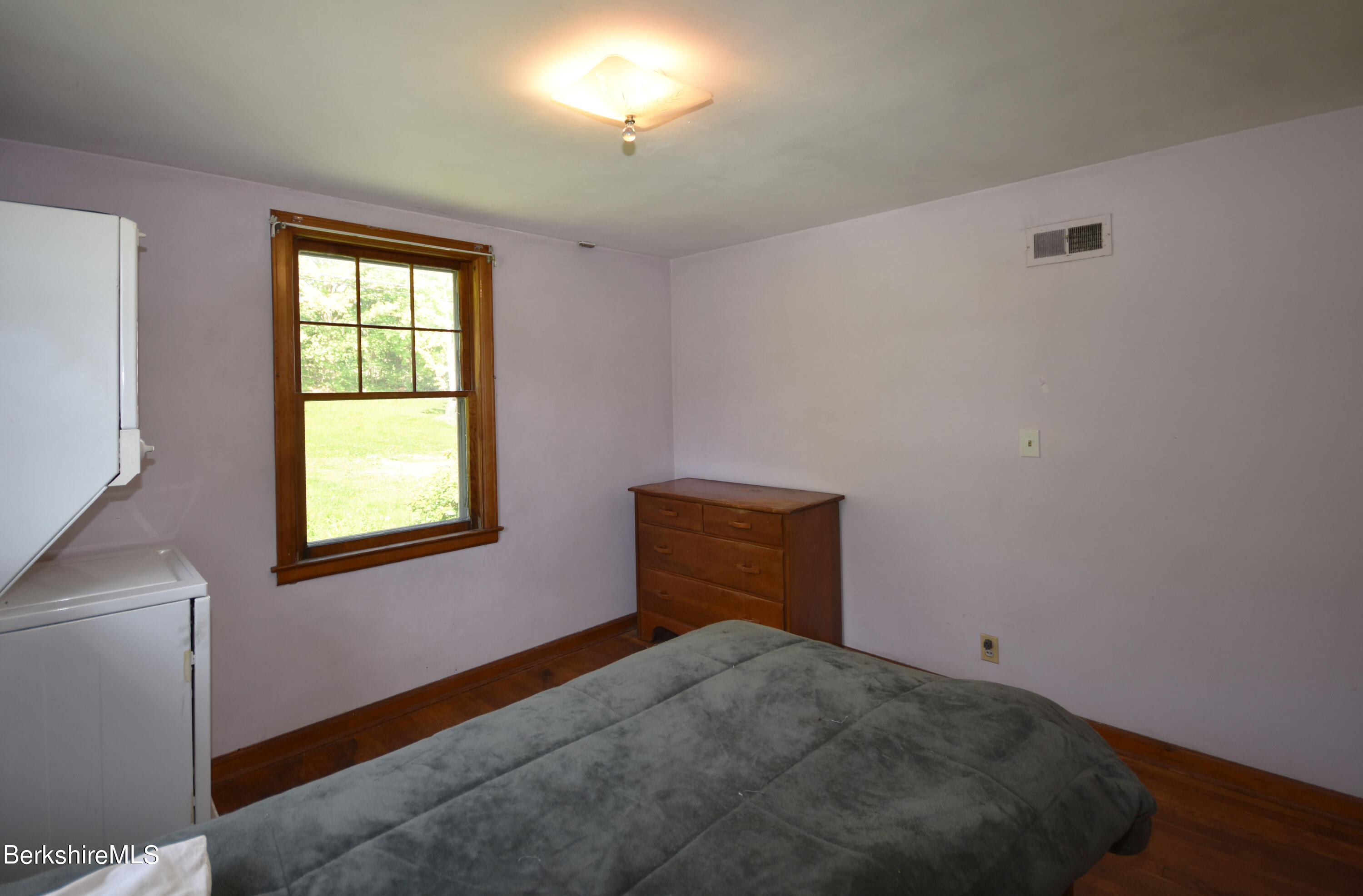 1649 State Road Richmond, MA 01254 - Photo 25 of 43 a bedroom with a bed and a window