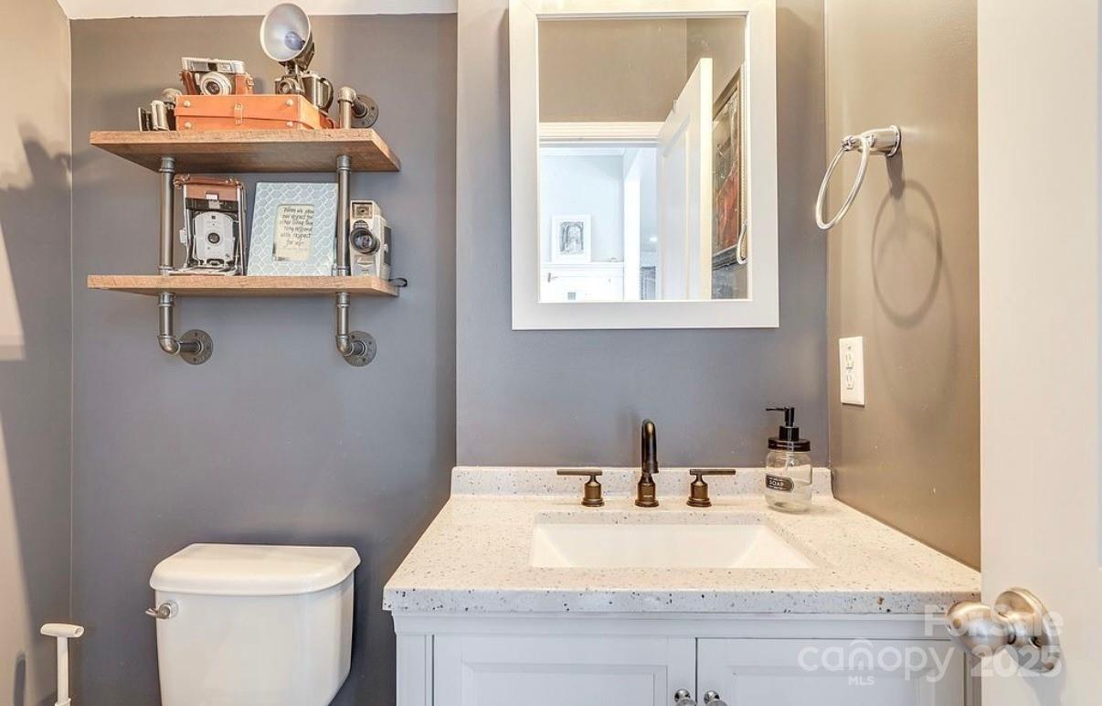 411 Stonefield Circle Moncks Corner, SC 29461 - Photo 17 of 42 a bathroom with a sink a toilet and a mirror