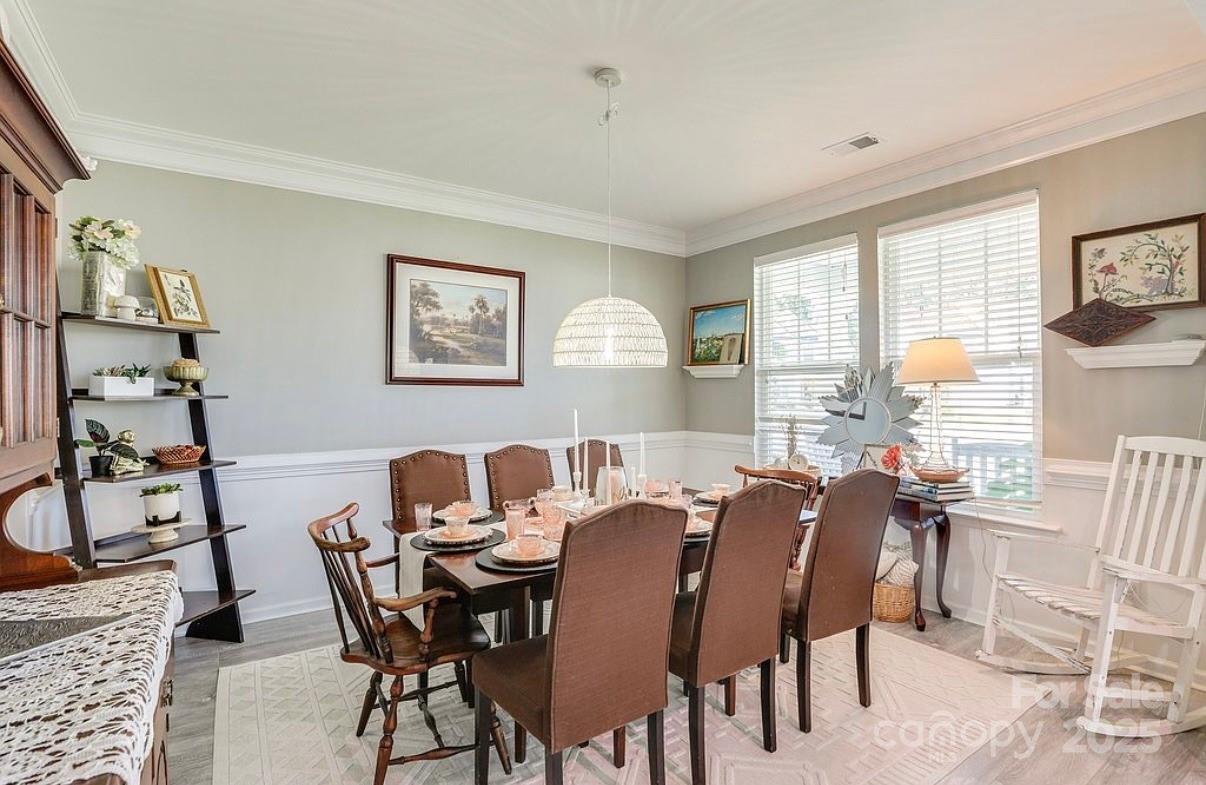 411 Stonefield Circle Moncks Corner, SC 29461 - Photo 18 of 42 a view of a dining room with furniture