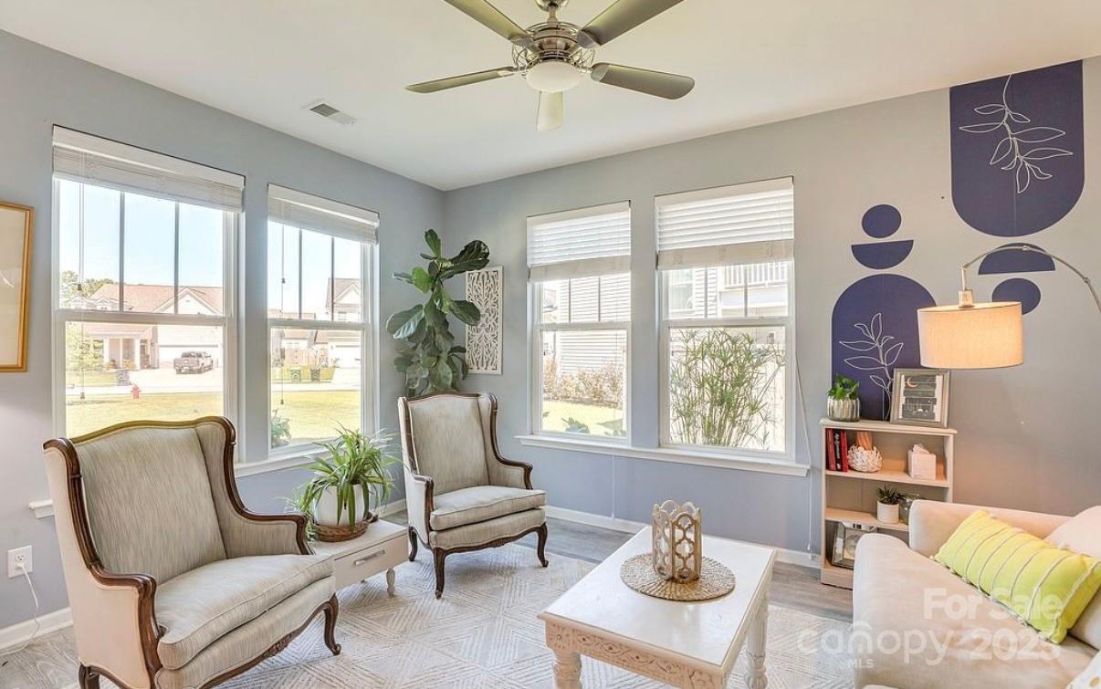 411 Stonefield Circle Moncks Corner, SC 29461 - Photo 20 of 42 a living room with furniture and a large window