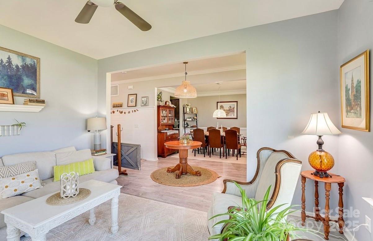 411 Stonefield Circle Moncks Corner, SC 29461 - Photo 21 of 42 a living room with furniture and chandelier