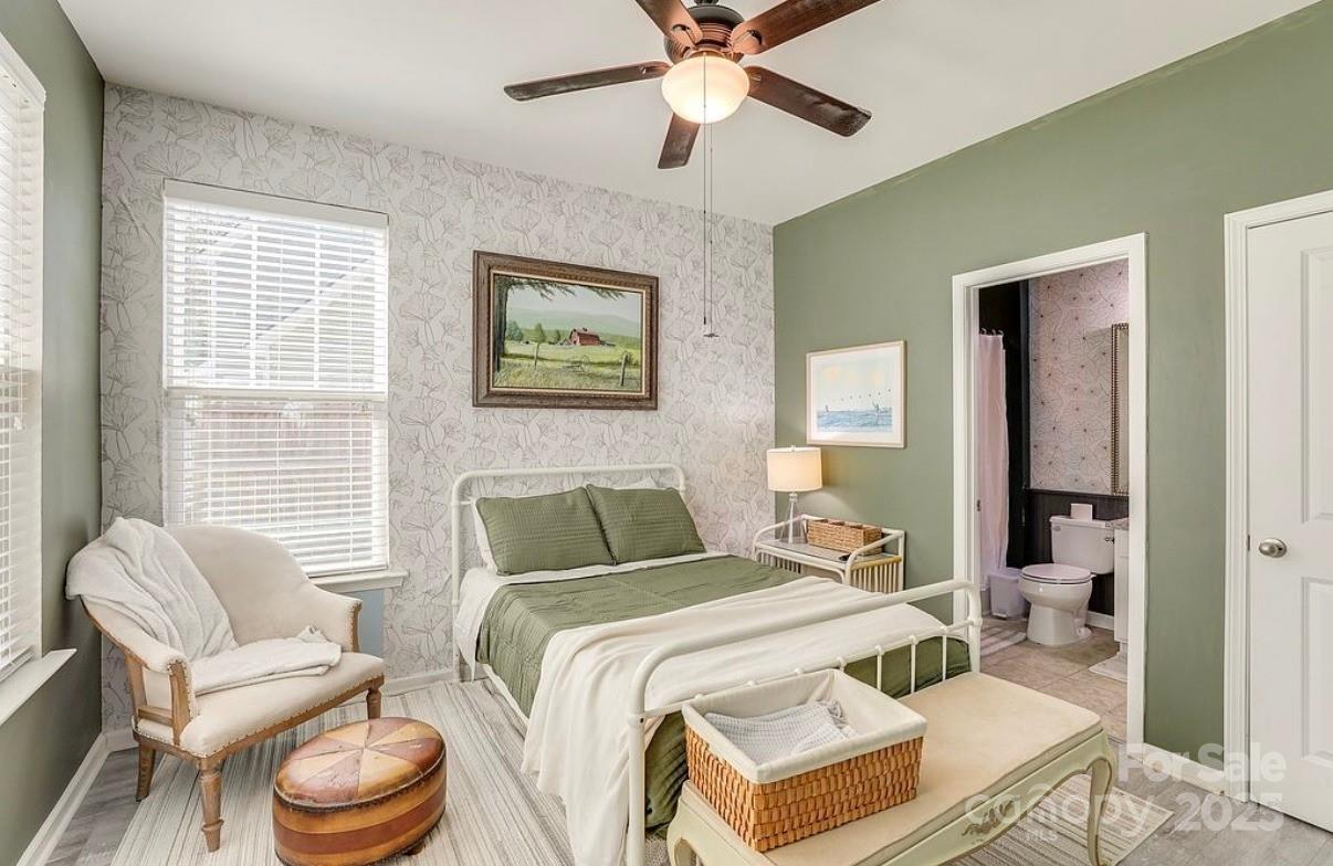 411 Stonefield Circle Moncks Corner, SC 29461 - Photo 22 of 42 a bedroom with a bed and wooden floor