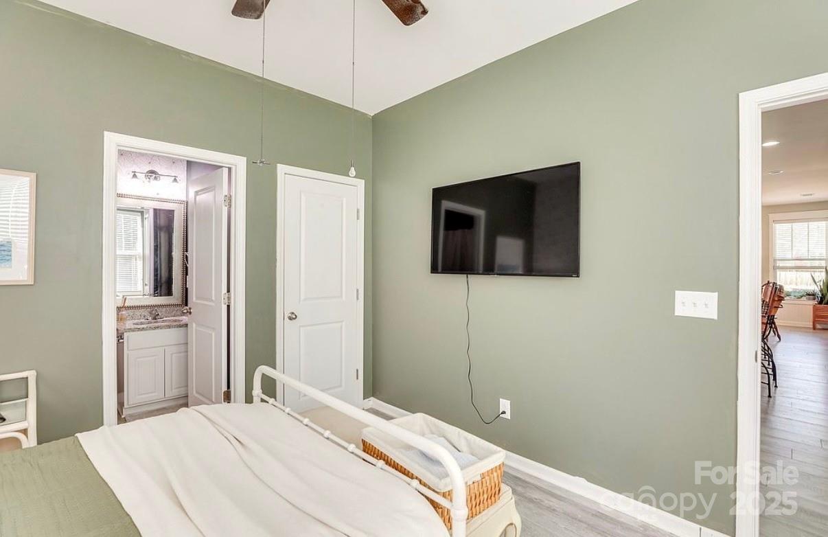 411 Stonefield Circle Moncks Corner, SC 29461 - Photo 23 of 42 a bedroom with a bed and a flat screen tv