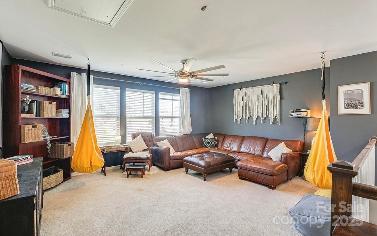 411 Stonefield Circle Moncks Corner, SC 29461 - Photo 26 of 42 a living room with furniture and a flat screen tv